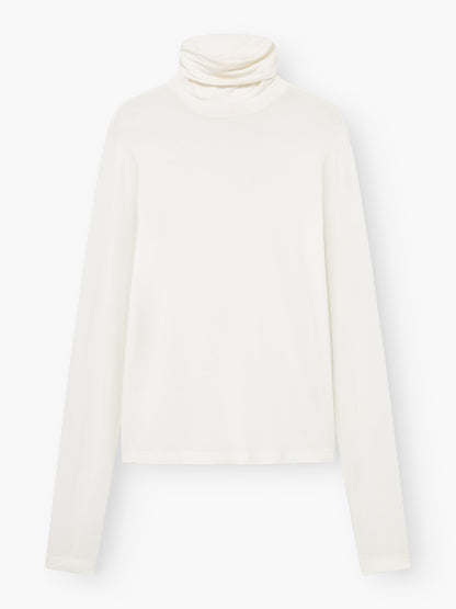Ein langärmeliges Rollkragen-Shirt der Marke „Turtle Jersey White“ liegt flach auf einem weißen Hintergrund, die Ärmel sind ausgestreckt und der Kragen ist heruntergeklappt.