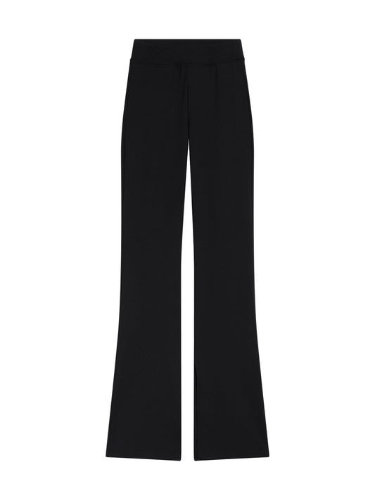 Leggings mit Schlitzen - 80% Recycled in Schwarz, mit hoher Taille, weitem Bein und dezenten Schlitzen am vorderen Saum, hergestellt aus recyceltem Polyester und flach auf hellgrauem Hintergrund.