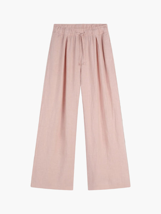 Weit geschnittene, hellrosa Hose Josy Linen Blush mit elastischem Bund und Kordelzug, flach auf weißem Grund - ideal als luftige Sommerhose für Frauen.
