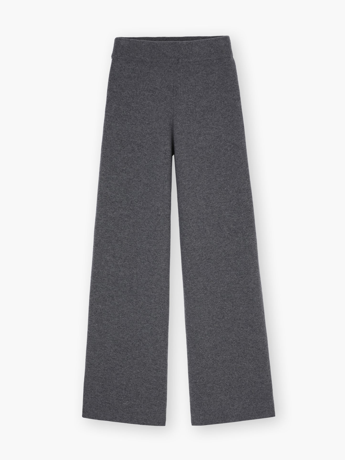 Die Hose Merino Grey ist eine dunkelgraue Hose mit weitem Bein aus weicher Merinowolle, die flach auf weißem Grund getragen wird und Komfort mit zeitlosem Stil verbindet.