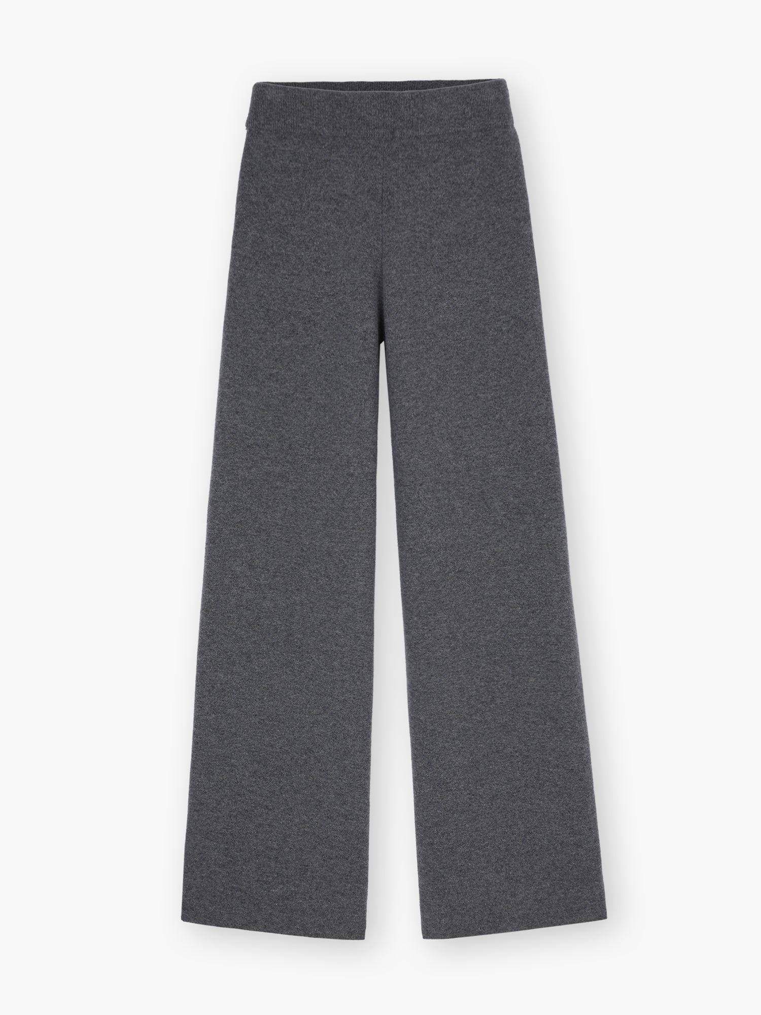 Die Hose Merino Grey ist eine dunkelgraue Hose mit weitem Bein aus weicher Merinowolle, die flach auf weißem Grund getragen wird und Komfort mit zeitlosem Stil verbindet.