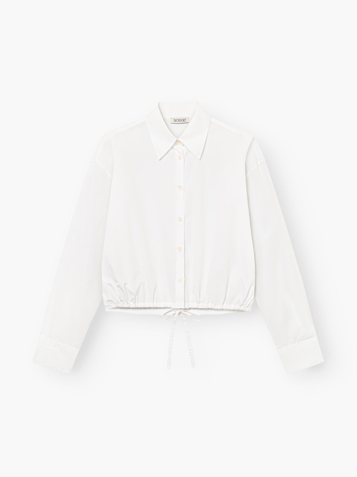 Die Bluse Draw String White ist eine weiße Baumwollbluse für Damen mit langen Ärmeln, einem klassischen Kragen und einem Kordelzug am Saum, die auf einem schlichten weißen Hintergrund abgebildet ist.