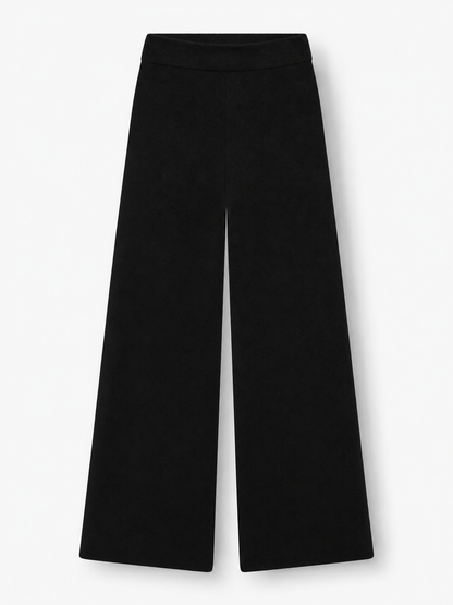 Die Merino-Hose „Schwarz“ wird vor weißem Hintergrund präsentiert und zeichnet sich durch einen hohen Bund sowie einen lockeren, geraden Schnitt mit weitem Bein aus.