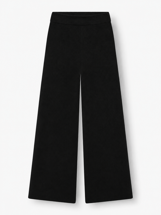 Die Merino-Hose „Schwarz“ wird vor weißem Hintergrund präsentiert und zeichnet sich durch einen hohen Bund sowie einen lockeren, geraden Schnitt mit weitem Bein aus.