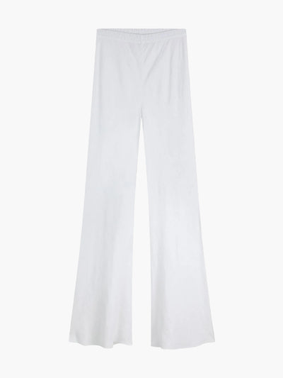 Die Pants Joana White ist eine hoch taillierte Damenhose aus 100% Leinen mit weitem Bein und leichtem Schlag - ideal für warme Tage. Präsentiert vor schlicht weißem Hintergrund.