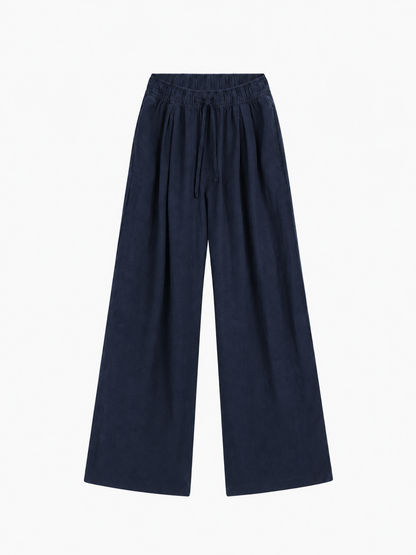 Hose Josy Linen Navy: marineblaue Hose mit weitem Bein aus einem bequemen Baumwollstoff mit elastischem Bund und Kordelzug.