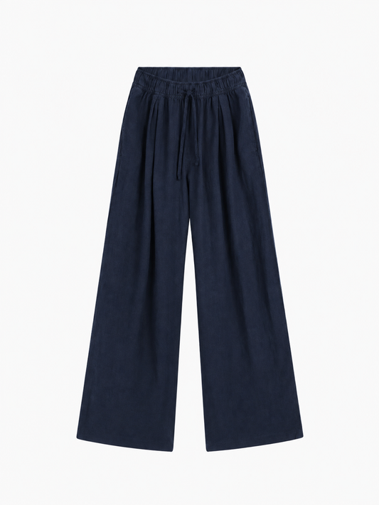 Hose Josy Linen Navy: marineblaue Hose mit weitem Bein aus einem bequemen Baumwollstoff mit elastischem Bund und Kordelzug.