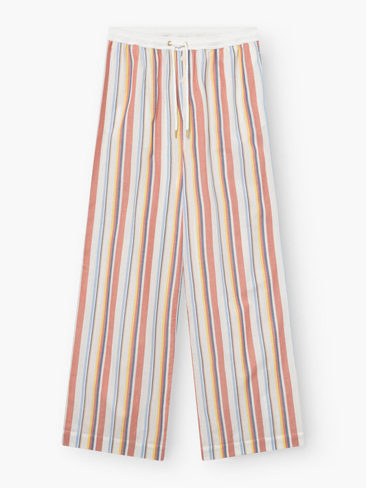 Hose New York: Locker sitzende Hose mit elastischem Bund und Kordelzug, mit vertikalen Streifen in Rot, Gelb, Blau und Orange auf weißem Grund.