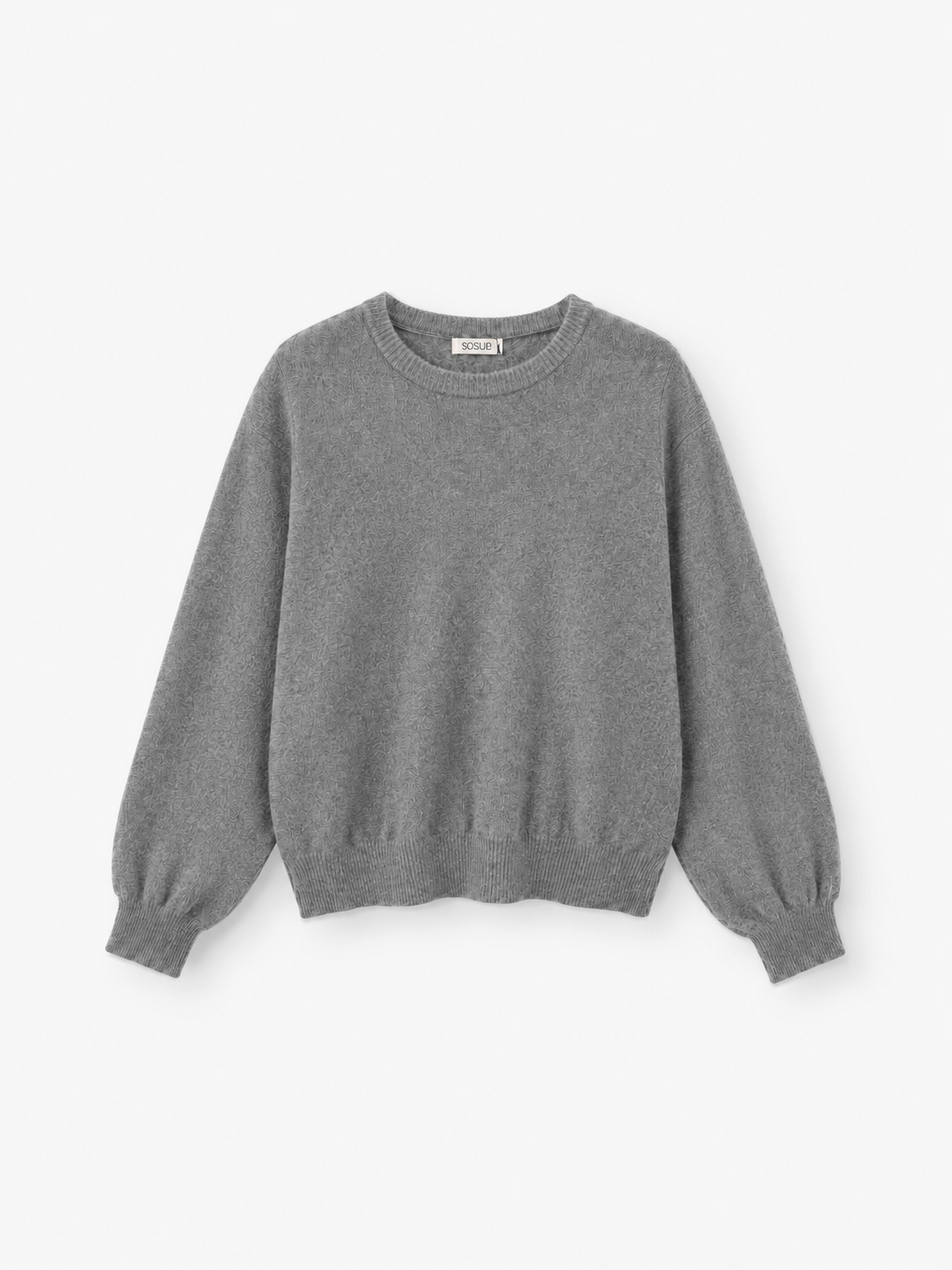 Ein schlichter, langärmeliger Damen-Strickpullover mit dem Namen „Pullover Tony Rundhals Grau“, der einen Rundhalsausschnitt sowie gerippte Bündchen und einen gerippten Saum in Grau aufweist, wird vor einem weißen Hintergrund präsentiert.
