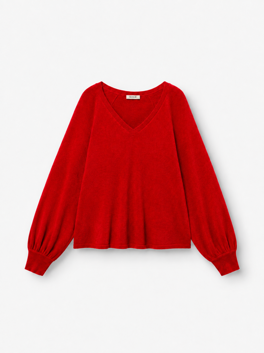 Ein langärmeliger Pullover „Antonia“ mit V-Ausschnitt in leuchtendem Rot, gefertigt aus luxuriöser Merinowolle und Kaschmir, mit weiten Ärmeln und gerippten Bündchen, abgebildet vor einem schlichten weißen Hintergrund.